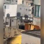 Video captures Israeli soldiers pushing dead bodies from roof