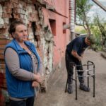 Ukrainian farmers risk lives to clear mines with rakes and tractors