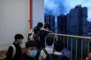 Hong Kong fire that killed dozens ‘under control’; hundreds still missing