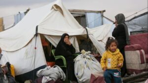 Israel kills at least three in Gaza, as thousands endure heavy flooding