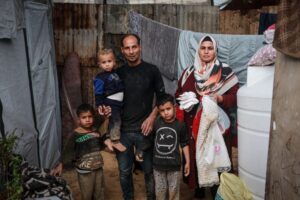 From war to winter: Gaza couple wait to welcome baby in flooded tent