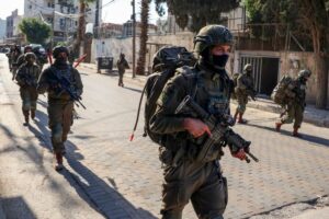 Young Palestinian dies in Israeli custody, dozens taken in West Bank raids