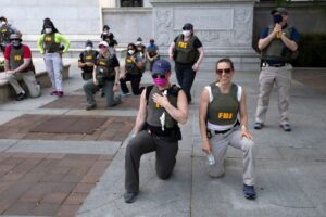 FBI agents allege wrongful termination for kneeling during US protest