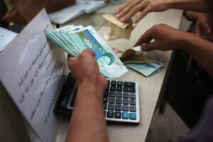 Iran’s currency drops to record low against dollar as tensions soar