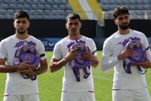 Iran footballers pay tribute to victims of school strike at start of war
