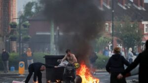 Protesters torch cars, buildings in Belfast after refugee knife attack