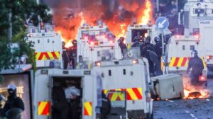 Police in Belfast use water cannon as anti-immigrant unrest continues