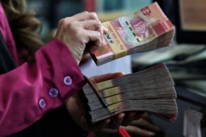 Indonesia’s anti-graft prosecutor quits after police seize gold and cash